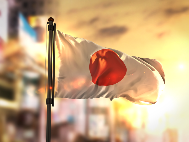 Japan flag against city background