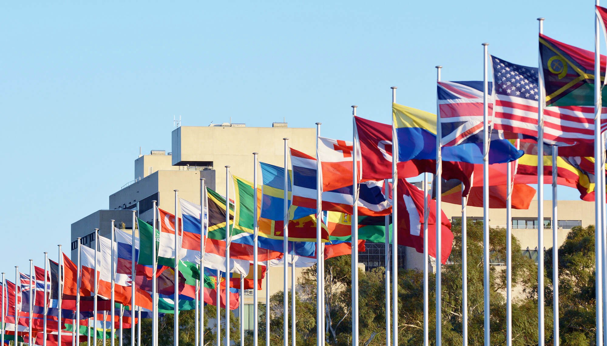Display of a variety of international flags on flag poles