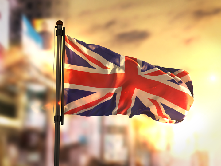 United Kingdom flag against city background
