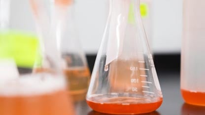 Erlenmeyer flask containing red liquid