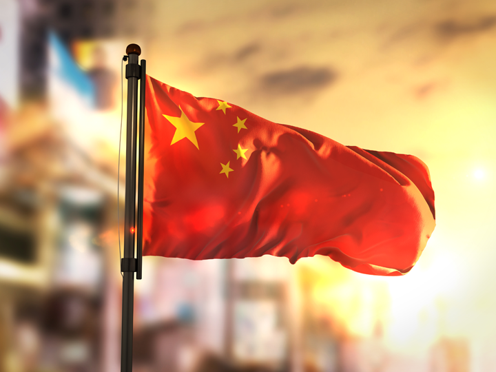 China flag against city background