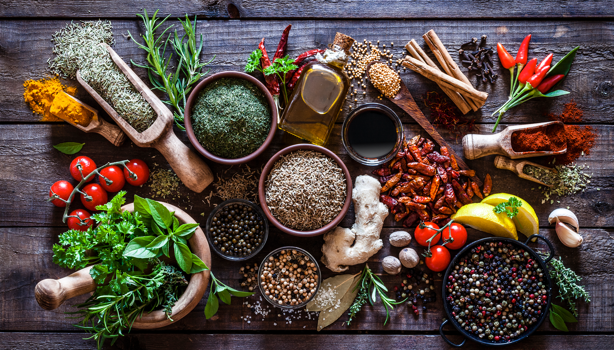 Various foods and ingredients laid out on wooden table