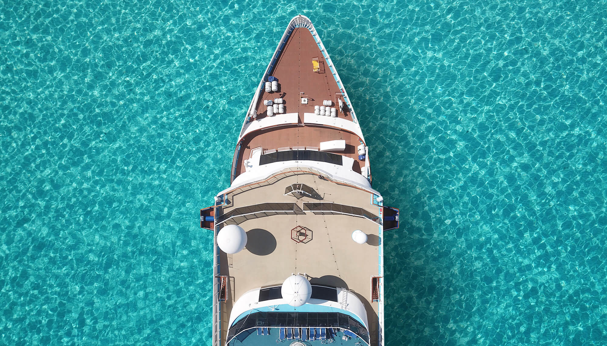A cruise ship floating in clear blue water