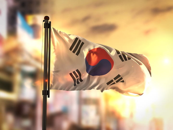 South Korea flag against city background
