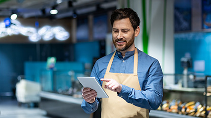smiling worker auding stock