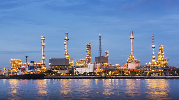 Oil Refinery on the water with a ship at port