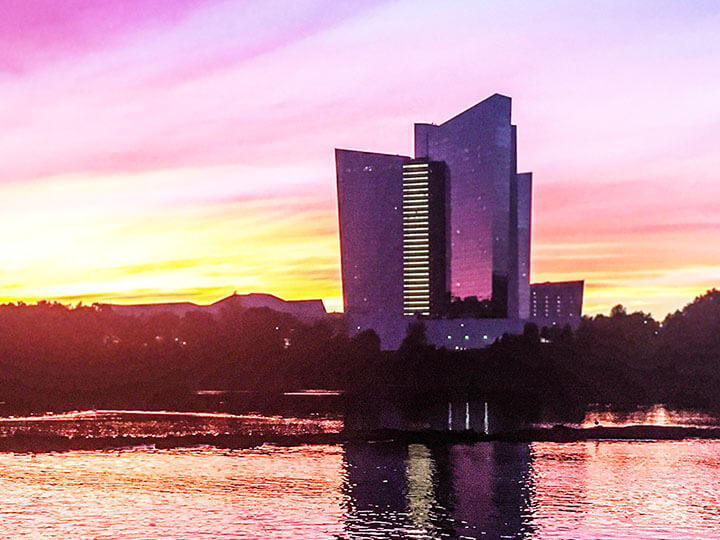 Beautiful sunset overlooking water and Mohegan Sun in Uncasville, CT in the background